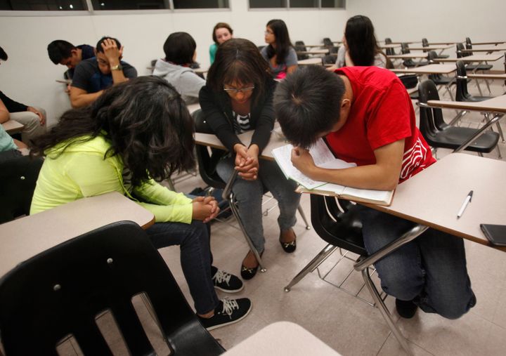 Students pray during an Intervarsity Christian Fellowship meeting at Cal State Northridge in September 2014. 