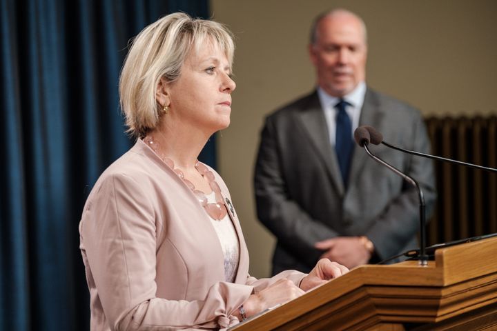 Dr. Bonnie Henry, B.C.'s provincial health officer, makes an announcement about the province's fall pandemic preparedness plan while Premier John Horgan looks on on Sept. 9, 2020.