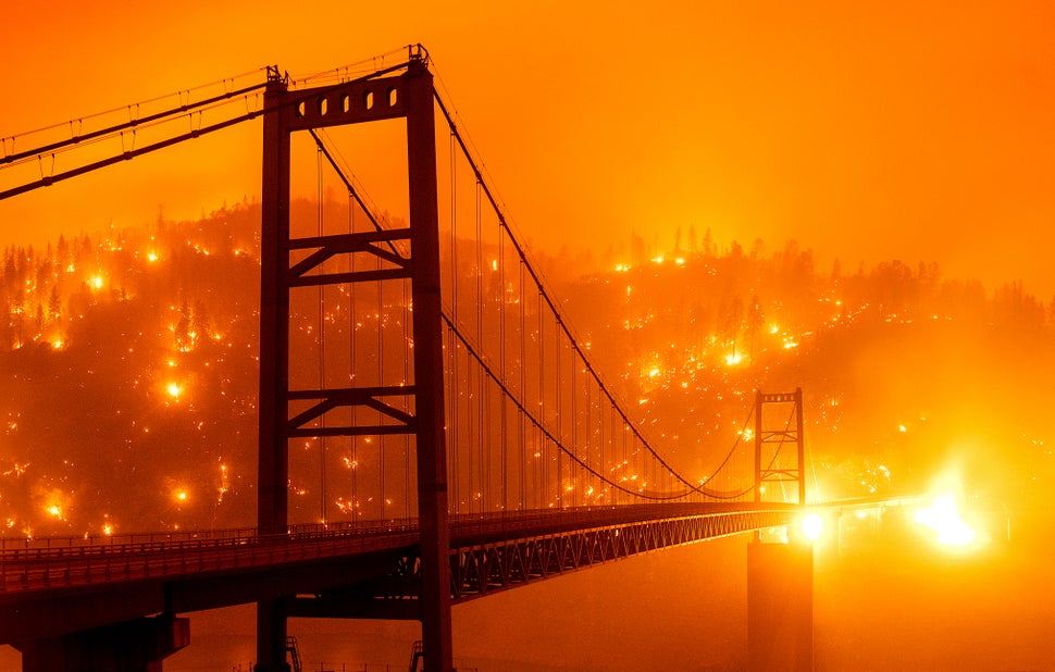 Embers light up a hillside behind the Bidwell Bar Bridge in Oroville, California.
