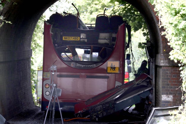 The scene on Well House Lane in Winchester after three children were taken to hospital with serious injuries while 13 others suffered minor injuries after the school bus they were travelling in crashed into a railway bridge.