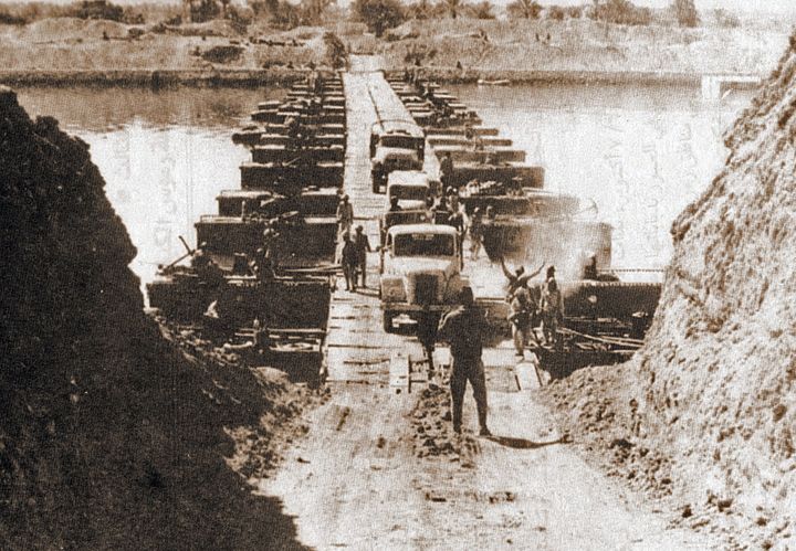 Egyptian military trucks crossing a bridge on Suez Canal during Yom Kippur War, 7th October 1973.