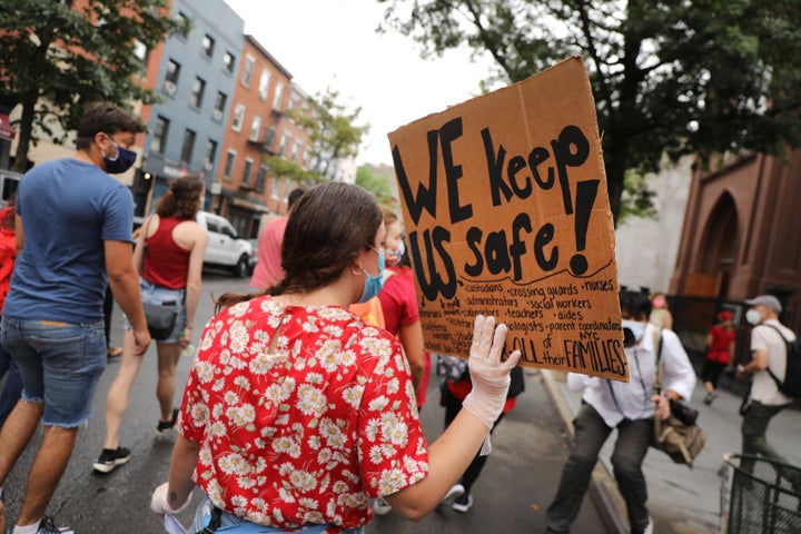 Members of the teachers union, parents and students participate in a march through Brooklyn, New York, on Sept. 1 to demand a safer teaching environment for themselves and students during the COVID-19 pandemic.