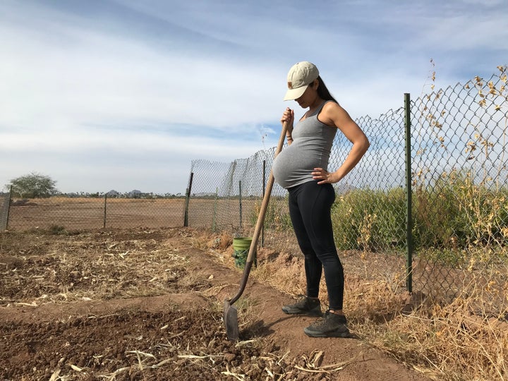 Women in my community traditionally stayed active outdoors during pregnancy. Here, I am helping my husband and brother-in-law in our family field. This is a place where our daughter now spends a lot of time. She helps us plant each season. The first food she planted was squash. In Indigenous cultures, we recognize the correlation between nourishing seeds and nourishing children. 