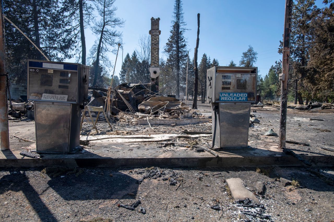 A service station is destroyed Tuesday after Malden, Washington, is overrun by wildfire. High winds kicked up flames across the Pacific Northwest on Monday and Tuesday, burning hundreds of thousands of acres. 