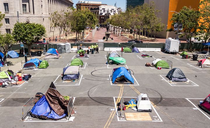 Rectangles on the ground encourage homeless people to observe social distancing at a city-sanctioned homeless encampment across from San Francisco City Hall in May.