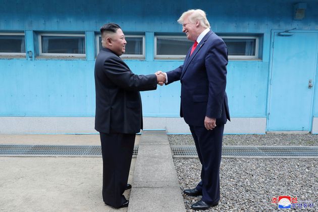 US President Donald Trump and North Korean leader Kim Jong-un meet and shake hands in Panmunjeom.