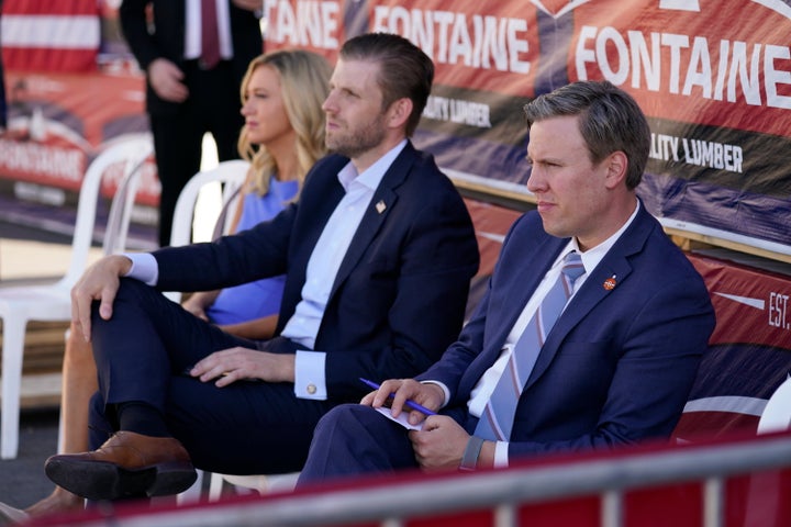 From left, White House press secretary Kayleigh McEnany, Eric Trump and campaign manager Bill Stepien listen as President Donald Trump speaks to a crowd of supporters on Aug. 20, 2020, in Old Forge, Pennsylvania.