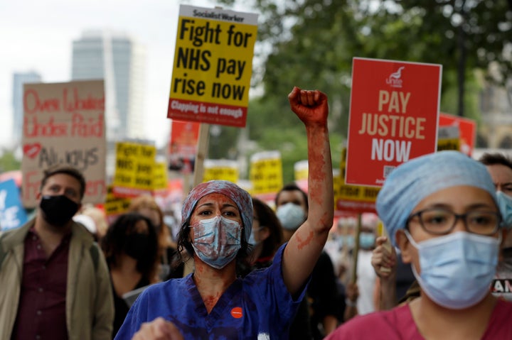 Nurses take part in a demonstration of NHS workers at hospitals across London to demand a 15 per cent pay rise by the government in London, Wednesday, Aug. 26, 2020.(AP Photo/Kirsty Wigglesworth)