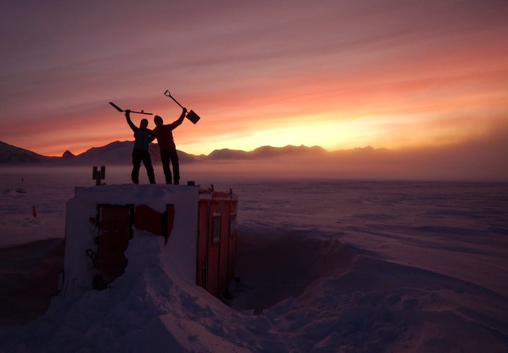 In this handout photo provided by British Antarctic Survey, field guides Sarah Crowsley, left, and Sam Hunt, right, pose for