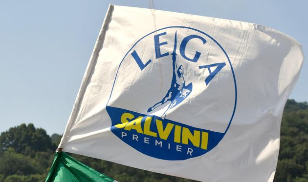 An Italian flag and a Lega flag fly at the Lega and rally in Pontida, on July 1 ...