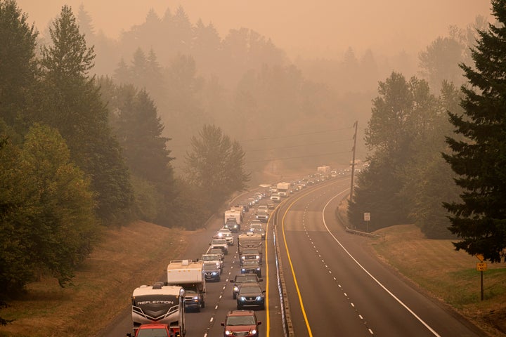 Oregon residents evacuate north along highway Highway 213 on Sept. 9 near Oregon City, Oregon. Multiple wildfires grew by hundreds of thousands of acres Thursday, prompting large-scale evacuations throughout the state.