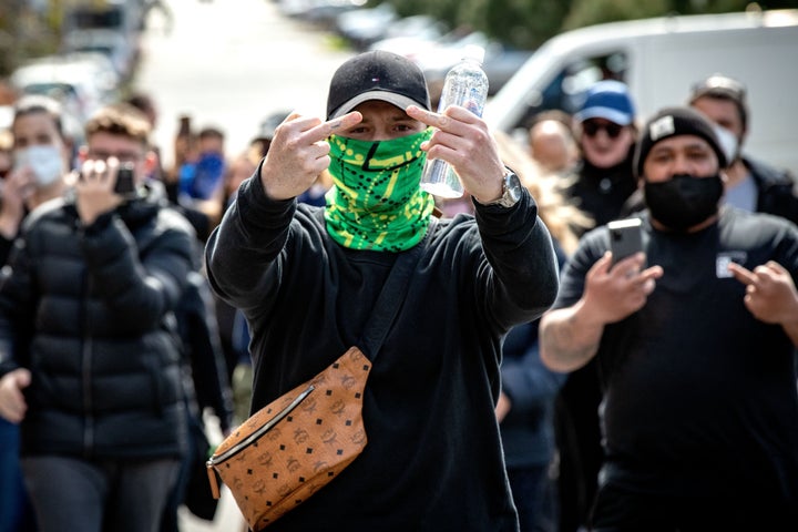 Protesters march through the streets of the city on September 13, 2020 in Melbourne, Australia. 