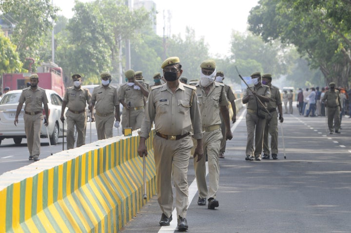 Police personnel stand guard outside the Covid Hospital in Sector 39, on August 8, 2020 in Noida.