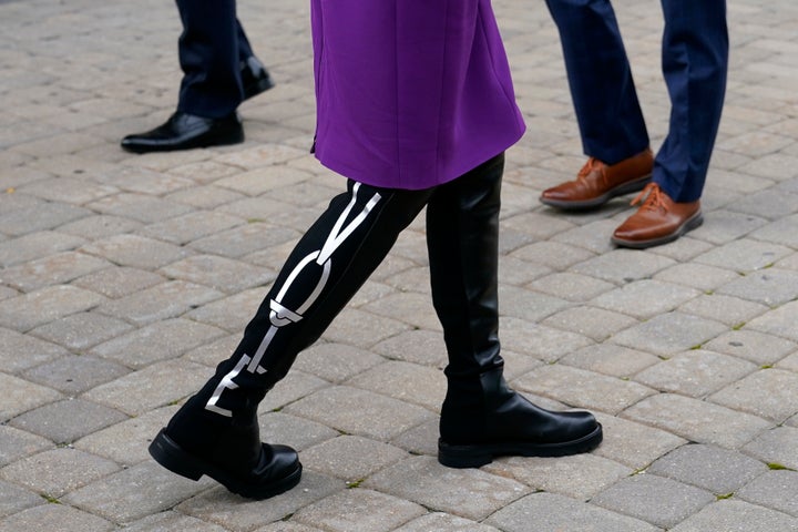 Jill Biden wears boots bearing the word "Vote" as she and her husband, Democratic presidential nominee Joe Biden, depart after voting early in Delaware's state primary election on Sept. 14, 2020.