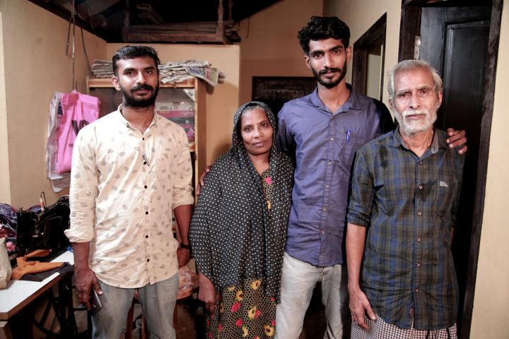 Thaha with his parents and elder brother after reaching his Kozhikode residence on Friday night. 