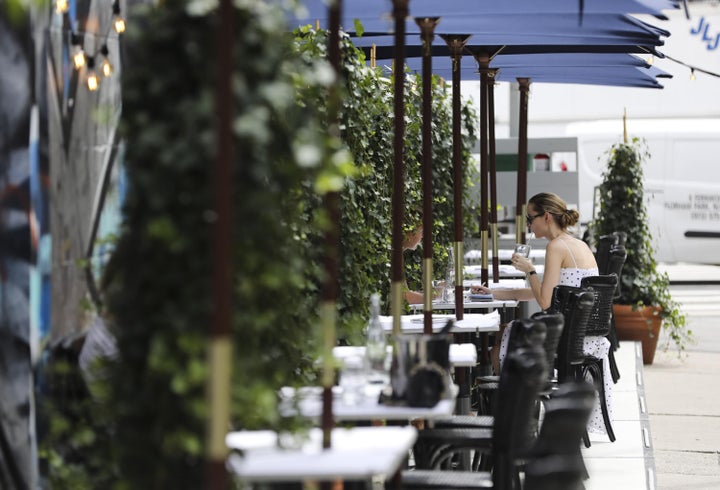 An outdoor dining area in New York City on July 30. Adults who tested positive for the coronavirus were roughly twice as