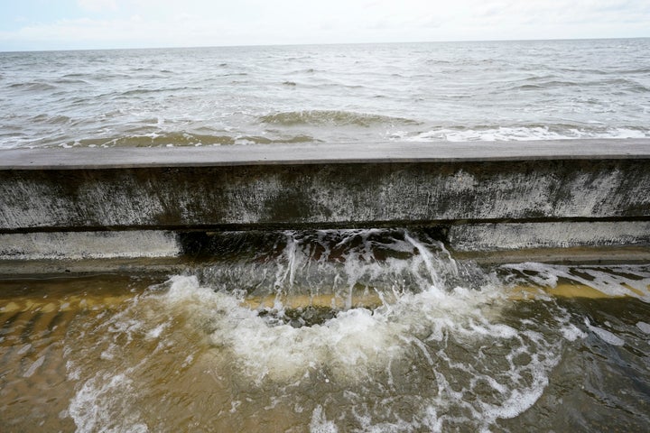Hurricane Sally, one of a record-tying five storms churning simultaneously in the Atlantic, closed in on the Gulf Coast on Mo