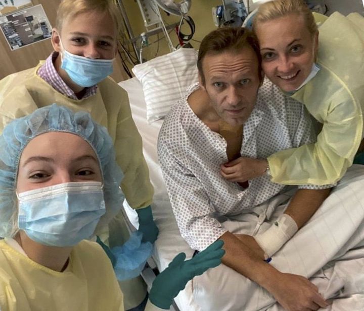 Russian opposition leader Alexei Navalny is seen with his wife Yulia, right, daughter Daria, and son Zakhar, top left, in a hospital in Berlin, Germany.