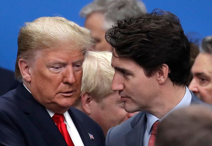 U.S. President Donald Trump, left, and Canadian Prime Minister Justin Trudeau arrive for a round table meeting during a NATO leaders meeting in England on Dec. 4, 2019.