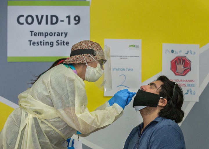 Dr. Nandini Sathi swabs Ander Malevran for a COVID test at a pop-up testing site set up by Michael Garron Hospital in Toronto. Identifying the testing site closest to you is a helpful way to prepare for a possible outbreak.