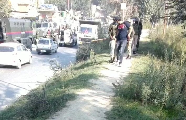 Photo shared by Kamran Yousuf of policemen hitting him in Pulwama.