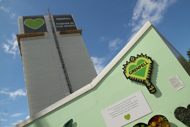 The 24 story shell that remained after the tragedy stands tall above the memorial site during the third anniversary.