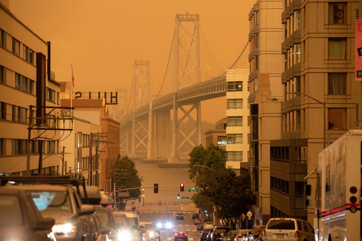 The Bay Bridge is seen under an orange sky darkened by the smoke from California wildfires in San Francisco, California, U.S., September 9, 2020. REUTERS/Stephen Lam TPX IMAGES OF THE DAY