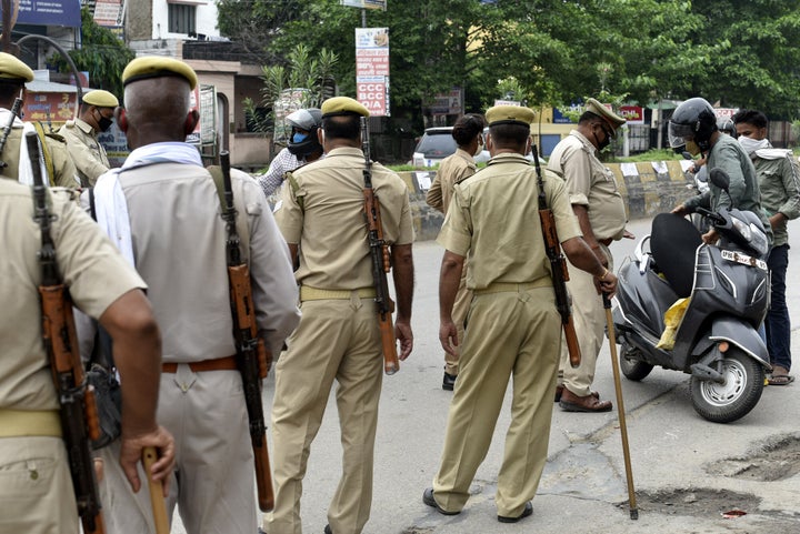 Uttar Pradesh Police personnel screen commuters during the lockdown at Kursi Road, on July 19, 2020, in Lucknow.