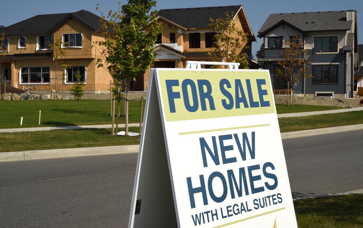 A sign advertises new homes for sale in Colwood, B.C., on Sept. 10, 2020. The national average home price set a new record in August at more than $586,000.
