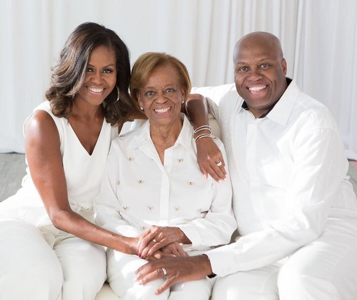 Michelle Obama with her mother, Marian Robinson, and brother, Craig Robinson.