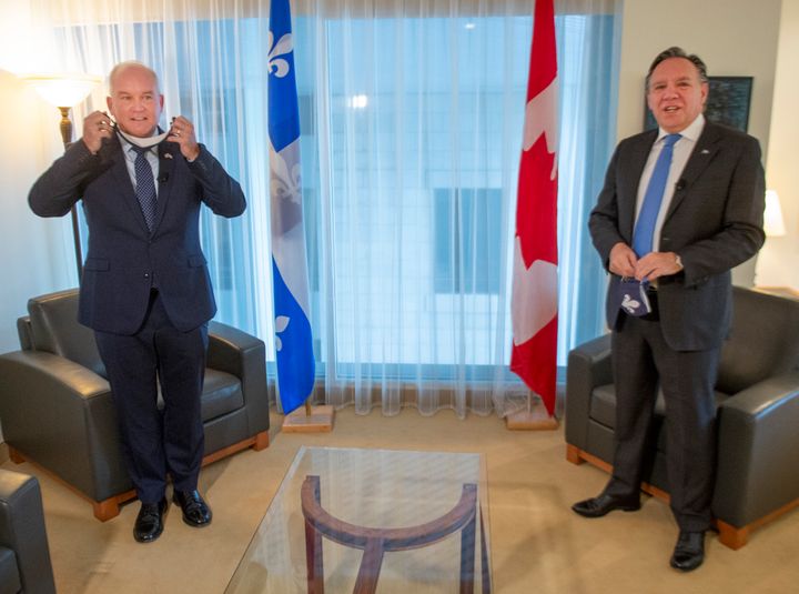 Conservative Leader Erin O'Toole, left, and Quebec Premier Francois Legault get set to start their meeting in Montreal on Sept. 14, 2020. 