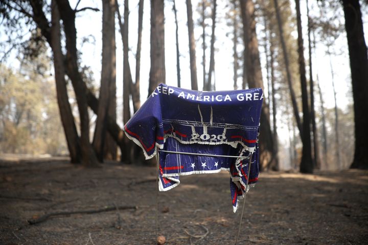 A melted Trump campaign sign sits in front of a home in Butte County that was destroyed by the North Complex fire, which has burned over 260,000 acres and killed at least 14 people.
