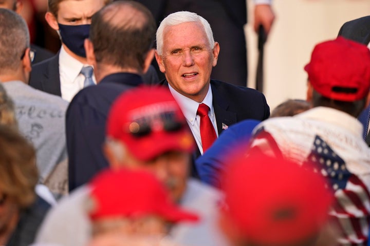 Vice President Mike Pence greets supporters Wednesday in Zanesville, Ohio. Earlier this week, Pence withdrew from attending an event that was tied to QAnon believers.