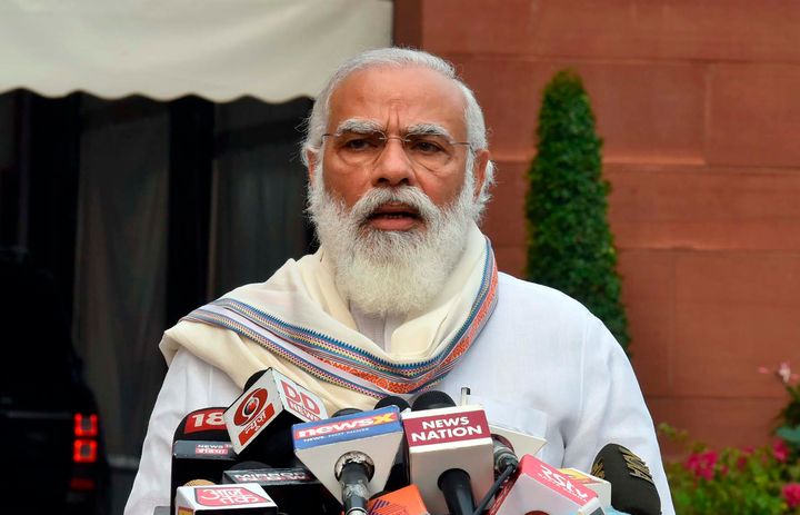 In this photo released by the Press Information Bureau, Prime Minister Narendra Modi addresses the media as he arrives at the Parliament in New Delhi, India, Monday, Sept.14, 2020.