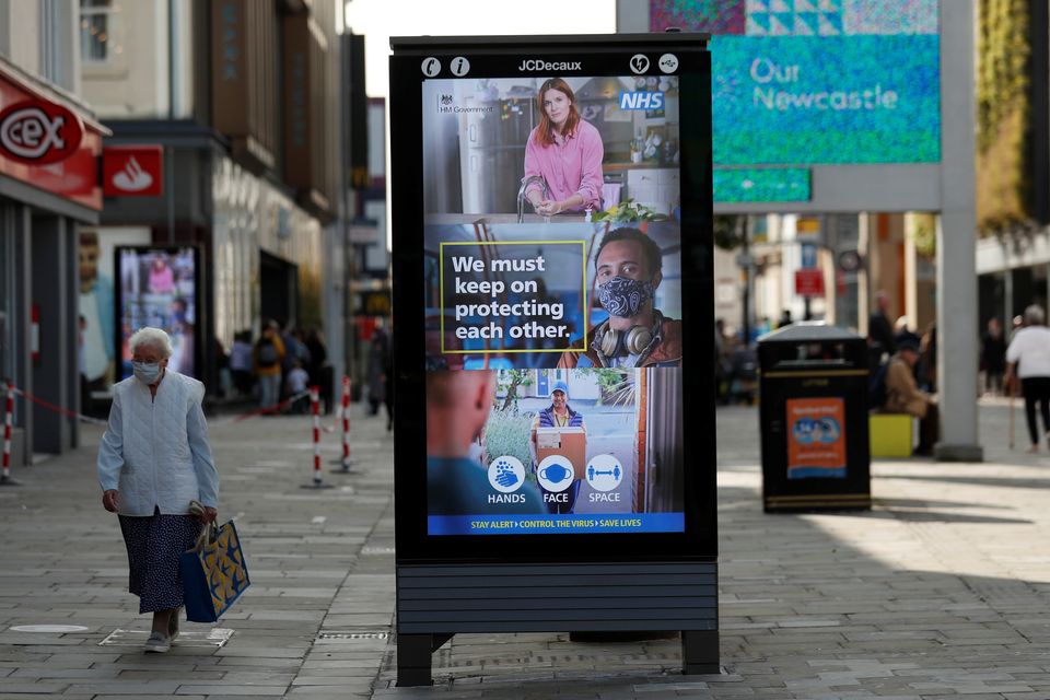 A sign of precautionary health and safety measures is seen on Northumberland Street, amid the coronavirus outbreak in Newcastle.