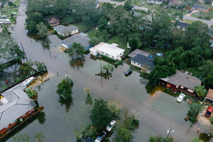 Downed trees and flooding are seen in West Pensacola near the Bayou Grove and Mulworth neighborhoods.