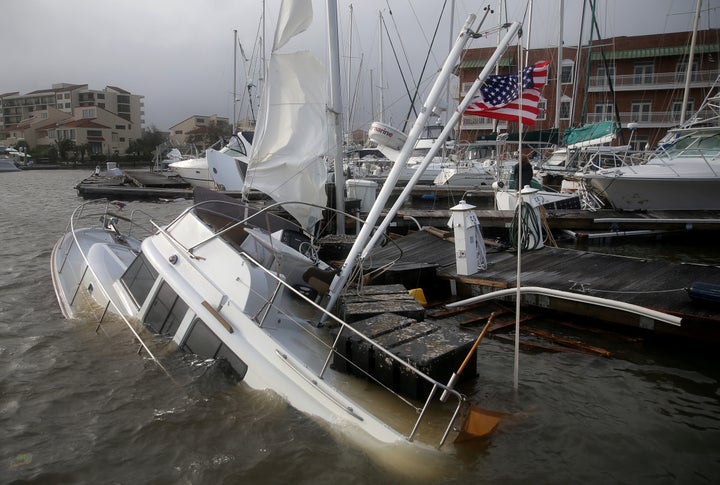 A U.S. flag flies from a boat damaged by Hurricane Sally in Pensacola, Florida, on Wednesday.