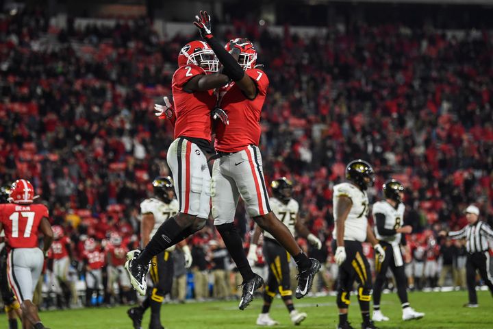 Critics said the University of Georgia was being hypocritical because it initially denied an on-campus voting site while planning to host football games with fans.