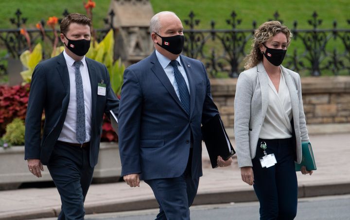 Conservative Leader Erin O'Toole walks in Ottawa with staffers on Sept. 9, 2020.