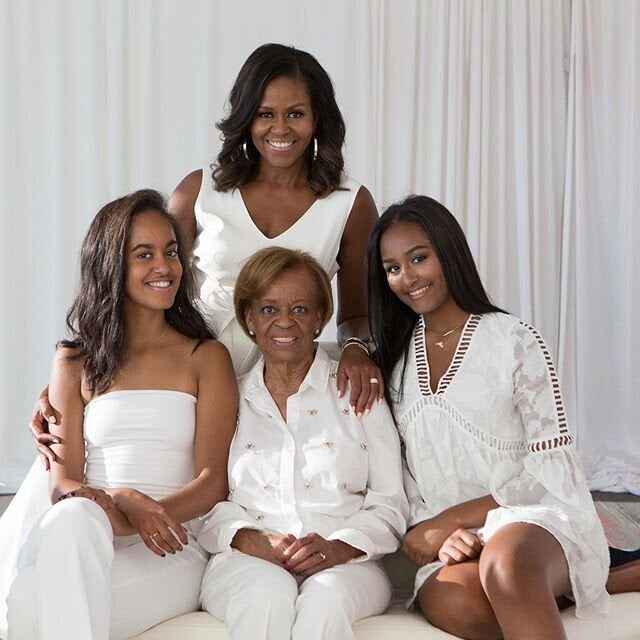 Michelle Obama with her daughters Malia (left) and Sasha (right), and her mother Marian Robinson.