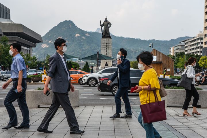 Pedestrians in face masks are a common sight in South Korea.