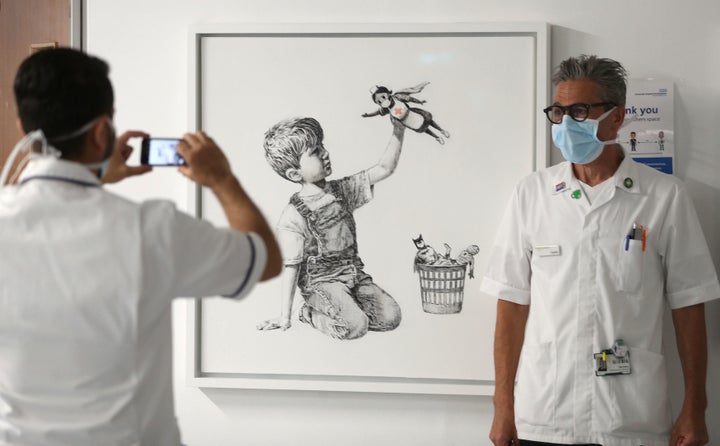 Banksy honored health care workers on the front lines of the coronavirus pandemic with this piece, titled “Game Changer."