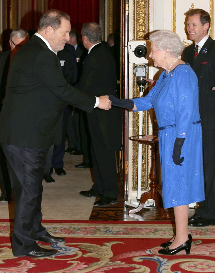 Queen Elizabeth II meets Harvey Weinstein during the Dramatic Arts reception at Buckingham Palace on February 17, 2014 in London.