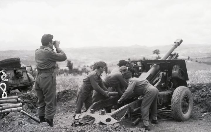 (Original Caption) 1948-Greece: A Greek mountain artillery gun shown in operation against a guerrilla position in the Grammos mountains.