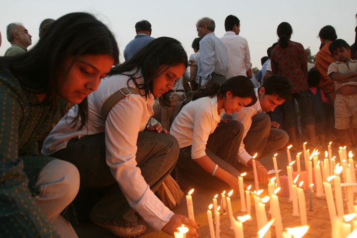 INDIA - MARCH 04: People protest against Jessica Lal case verdict in which main accused Manu Sharma along with nine others was acquitted from the charge of murder at the India Gate, New Delhi, by lighting candles. (Photo by Arijit Sen/The The India Today Group via Getty Images)
