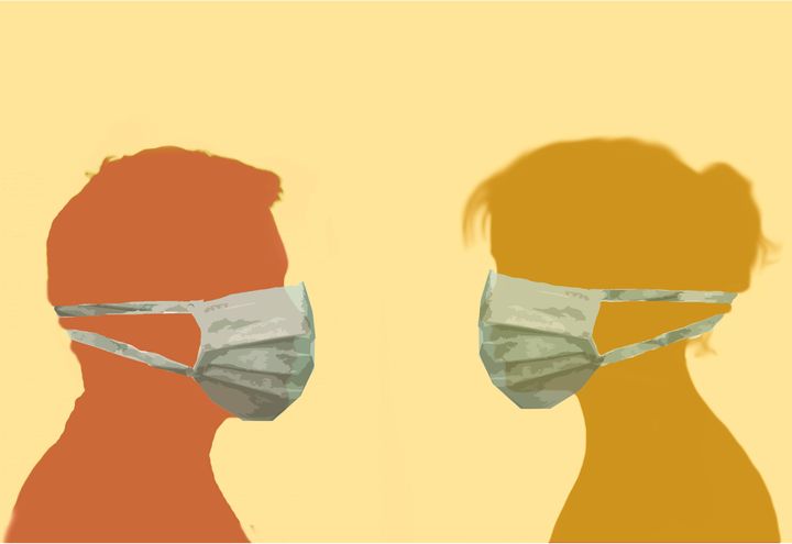 profile image of a man and woman facing each other wearing surgical face masks depicting protection