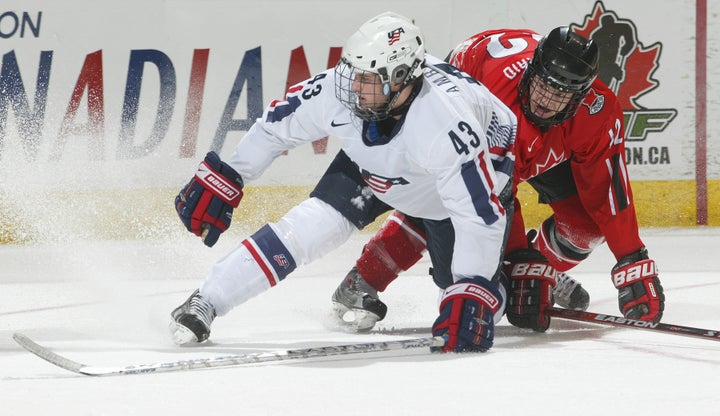 Team USA's Tyler Amburgey (No. 43) collided with Peter Holland of Team Ontario at the 2008 World Under 17 Challenge in Canada.