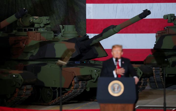 President Donald Trump speaks to workers in front of tanks on display at the Lima Army Tank Plant Joint Systems Manufacturing Center, the country's only remaining tank manufacturing plant, in Lima, Ohio, on March 20, 2019.