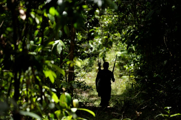 A Tenetehara Indigenous man patrols with the Ka’Azar, or Forest Owners, on the Alto Rio Guama reserve...