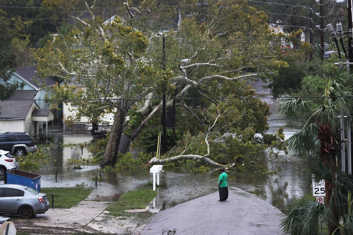 A person looks at a flooded neighborhood as Hurricane Sally passes through the area on Sep.16 in Pensacola, Florida. 